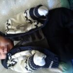 Isaac smiling in his suit