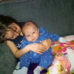 Isaac pulling out a smile with cousin Isabelle