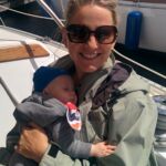 Sam holding a napping Isaac in 15 knot wind!