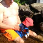 Opa and Isaac playing in the waves