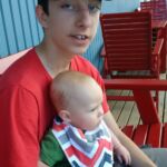 Zavier finally holding Isaac!