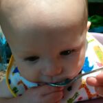 likes the spoon more than the food...