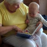 Grandma putting Isaac to bed.