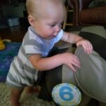 Isaac standing with his elephant