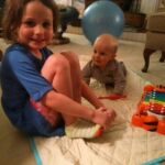 Cousin Isabelle entertaining Isaac