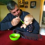 Uncle Frank feeding Isaac butternut squash soup...or is that apple pie???