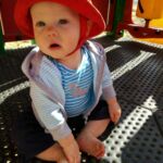 Playing on the big kid play structure at the park.