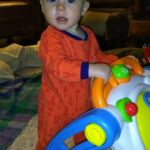Isaac taking a few steps with the walker toy (in his Home Depot PJs as Opa calls them...)