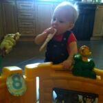 standing with one hand to balance, sometimes he lets go!