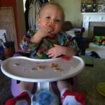 Isaac feeds himself now