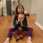 Isabelle looking after Isaac