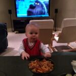 Isaac enjoying Grandpa Brian's holiday snacks