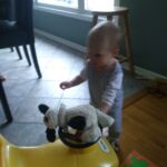 Isaac liked to push his toys around in his car