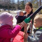 the kids trying out the dogsled