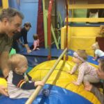 Isaac and Inez are taking gymnastics together