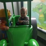 Driving the tractor at Kid's Kingdom