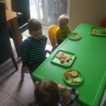 Sitting at the big kid table for Leo's birthday party