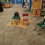 rearranging all the chairs in the library