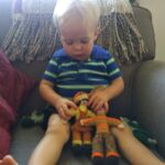 Playing with the dolls Super Oma made when Lindy was a kid.