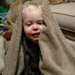 Isaac loves pretending to sleep, makes sure everyone has a blanket and then "night night"