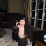 trying on the witch's hair