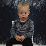 Isaac 18 months old - daycare photo day - how they got him to sit still like that is a wonder...but he wasn't too happy about it!