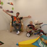 Mat showing Isaac their new playroom