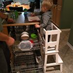 Isaac helping to load the dishwasher