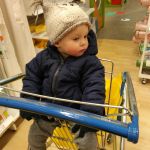 Isaac not feeling so well, sitting calmly in the cart