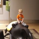 Isaac riding a beattle