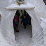 Checking out the tepee at Jacques Cartier Park