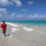 Isaac asleep on Jon during the beach walk