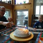 Opa lighting the birthday candles