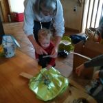 Oma reading Isaac his 2 year old birthday card