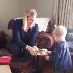 Opening his gift from Grandma and Papa