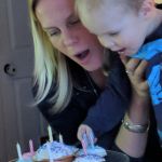 Blowing out his candles