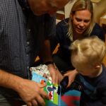 Opening gifts with mommy and daddy