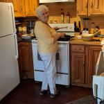 Barb cooking breakfast at the cottage