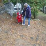 Oma and Isaac helping to close up the cottage