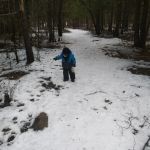 Isaac leaving seeds for the animals on the trail