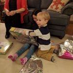 helping Izzy open her presents