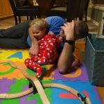 Cuddling with daddy in new xmas pj's from Grandma