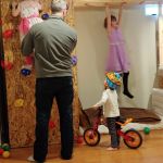 Cousins Alora and Olivia playing with Isaac in the basement