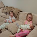 Cousins Finley and Lyla so excited to hold babies