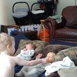 Isaac taking care of the babies