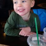 Isaac happy after skating lessons with Aunt Sam