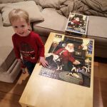 Isaac proud of finishing the puzzle!