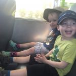 on a school bus, sitting with Gale