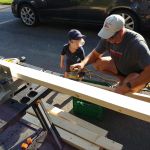 helping daddy build a picnic table