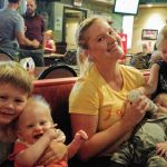 Sarah and Eleri, and Leo helping take care of the babies